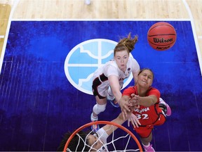 Lauren Ware #32 of the Arizona Wildcats is pressured by Haley Jones #30 and Alyssa Jerome #10 of the Stanford Cardinal in the National Championship game of the 2021 NCAA Women's Basketball Tournament at the Alamodome on April 04, 2021 in San Antonio, Texas.