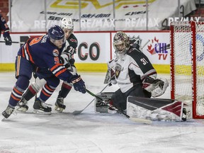 Vancouver Giants netminder Trent Miner foils Kamloops Blazers forward Josh Pillar with help from Giants defenceman Tanner Brown in Vancouver's 4-0 win on Monday.