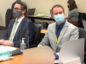 Former Minneapolis police officer Derek Chauvin, right, and his defence attorney Eric Nelson attend closing arguments during Chauvin's trial for second-degree murder, third-degree murder and second-degree manslaughter in the death of George Floyd with his defense attorney Eric Nelson in Minneapolis, Minn., April 19, 2021 in a still image from video.