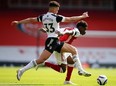 Antonee Robinson (left) and Fulham take on Chelsea this weekend
