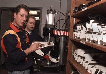 Canucks equipment managers Pat O'Neill (left) and Darren Granger work on skates in January 1997.