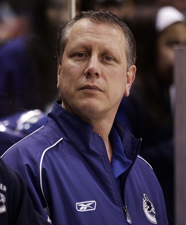 Canucks equipment manager Pat O'Neill watches warm-up before a game in October 2008.