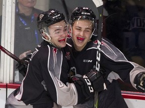 Vancouver Giants forward Tristen Nielsen (left) celebrates a goal by defenceman Tanner Brown (right) during the 2019/20 season.