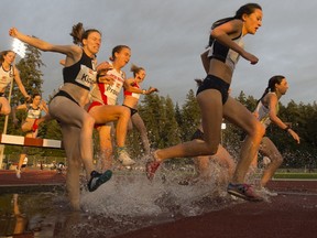 Runners take part in the 3,000-metre steeplechase during the Harry Jerome International Track Classic in Burnaby on June 20, 2019.