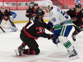 Canucks captain Bo Horvat, pushing Ottawa’s Shane Pinto to the ice during Monday’s 2-1 Canucks loss, says ‘obviously we knew it wasn’t going to be easy coming back from COVID.’