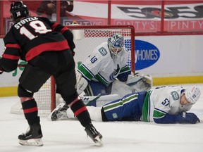 Vancouver Canucks goalie Braden Holtby (49) makes a save on a shot from Ottawa Senators left wing Tim Stutzle (18) in the second period at the Canadian Tire Centre.
