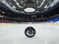 A detailed view of a puck after the game between the Calgary Flames and Vancouver Canucks scheduled for Wednesday was postponed due to COVID-19.