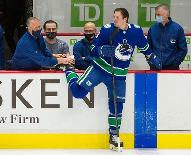 J.T. Miller gets his skate worked on by Canucks equipment manager Pat O'Neill before playing Ottawa on Jan. 27, 2021.
