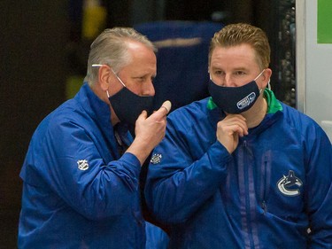 Vancouver Canucks equipment manager Pat O'Neill (left) and assistant equpment manager Brian Hamilton before a game against the Ottawa Senators at Rogers Arena in Vancouver on Jan. 27, 2021.