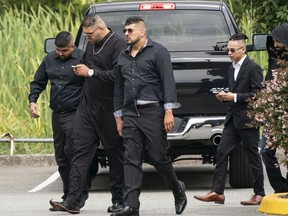Harb Dhaliwal (centre, with arms straight down) outside a funeral service in August 2019 for slain Hells Angel Suminder ‘Allie’ Grewal. On the right, also wearing sunglasses, is Tyrel Nguyen Quesnelle, who was later charged with murder in connection with the 2017 death of gangster Randy Kang.