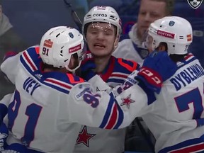 Vasily Podkolzin is mobbed by his SKA St. Petersburg teammates after scoring the winner in the third overtime period of Game 5 against CSKA Moscow in the KHL playoffs on Saturday.
