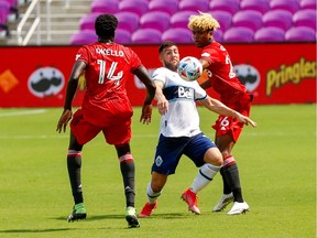Vancouver Whitecaps forward Lucas Cavallini (9) receives a pass in the first half in a game against Toronto FC at Orlando City Stadium.