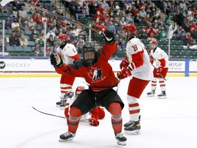 Connor Bedard of Canada reacts after scoring against Sergei Ivanov of Russia during the 2021 IIHF Ice Hockey U18 World Championship gold-medal game at the Comerica Center on May 6 in Frisco, Tex.