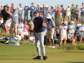 Phil Mickelson of the United States gives a thumbs up after putting on the 16th green during the final round of the 2021 PGA Championship held at the Ocean Course of Kiawah Island Golf Resort on May 23, 2021 in Kiawah Island, South Carolina.