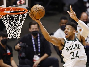 Giannis Antetokounmpo #34 of the Milwaukee Bucks goes up for a layup against the Miami Heat during the first quarter in Game Three of the Eastern Conference first-round playoff series at American Airlines Arena on May 27, 2021 in Miami, Florida.