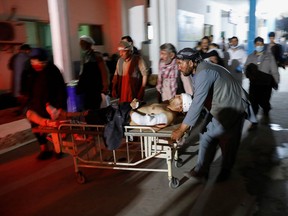 An injured person is transported to a hospital after a blast in Kabul, Afghanistan May 8, The death toll rose to 58 on Sunday.
