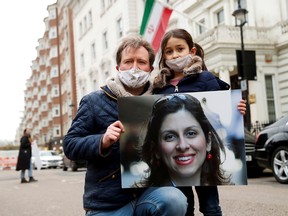 Richard Ratcliffe, husband of British-Iranian aid worker Nazanin Zaghari-Ratcliffe, and their daughter Gabriella protest outside the Iranian Embassy in London, Britain March 8, 2021.