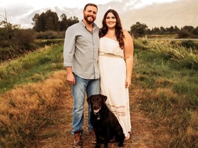 Emily and Steven McManus and their dog Duke are shown in a handout photo after they were engaged in 2019. They had a small wedding ceremony with a few guests in 2020 but Emily didn't wear her wedding dress and hopes to do that on her big day in front of lots of guests in July 2022 after twice cancelling wedding dates due to the pandemic.