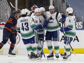 Vancouver Canucks forward Nils Höglander  celebrates a first period goal against the Edmonton Oilers at Rogers Place.