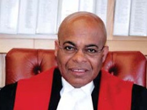 Selwyn Romilly, a Black retired Supreme Court judge, said he will not be filing a complaint after being arrested for matching the description of a suspect being sought