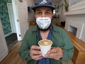 Wallace Espresso founder and owner Daniel Wahlen shows an oat milk espresso at his Toronto cafe.