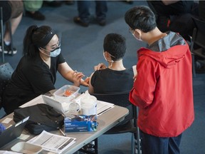 Hundreds of Surrey residents receive their COVID-19 vaccination at a pop-up clinic at the Surrey Sports and Leisure Complex on Saturday, May 22, 2021.