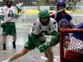 Jesse King of the Victoria Shamrocks fires a shot at the net while taking a shot to the neck from Brett Craig of the Maple Ridge Burrards during the last Western Lacrosse Association championship final series played in August 2019. The Shamrocks were the last WLA champions before the COVID-19 pandemic hit.