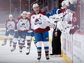 Mikko Rantanen of the Colorado Avalanche celebrates with teammates on the bench after scoring a goal against the Arizona Coyotes during the first period of the NHL game at Gila River Arena on March 22, 2021 in Glendale, Arizona.