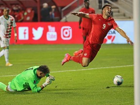 Lucas Cavallini of Canada is fouled by Warner Hahn of Suriname during a FIFA World Cup Qualifier at SeatGeek Stadium on June 8 in Bridgeview, Ill.