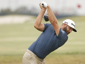 Dustin Johnson plays a shot on the range during a practice round prior to the start of the 2021 U.S. Open at Torrey Pines Golf Course on June 14, 2021 in San Diego, California.