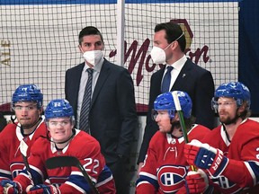 Assistant coaches Alex Burrows (left) and Luke Richardson of the Montreal Canadiens manage the bench during the first period in Game Three of the Stanley Cup semifinals against the Vegas Golden Knights at Bell Centre on June 18, 2021 in Montreal.