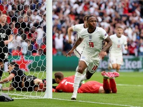 Raheem Sterling of England celebrates after scoring their side's first goal during the UEFA Euro 2020 Championship Round of 16 match between England and Germany at Wembley Stadium on June 29, 2021 in London, England.