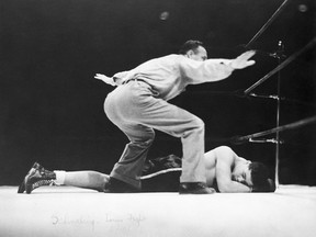 Joe Louis lies on the canvas after being knocked out by Max Schmeling in their first fight on June 19, 1936.