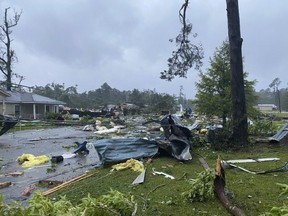 This photo provided by Alicia Jossey shows debris covering the street in East Brewton, Ala., on Saturday, June 19, 2021.