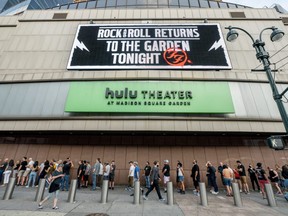 Fans stand in line to get into the Foo Fighters show as Madison Square Garden reopens with the first full capacity concert since March 2020, on Sunday, June 20, 2021 in New York City.