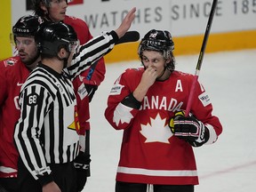 Canada's Troy Stecher speaks to a referee during a game on June 1. He set up the overtime winner against Russia Thursday.