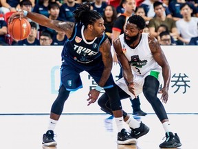 O.J. Mayo of the Fubon Braves (left) tries to shield the ball from Macau Braves guard Kenny Manigault during their ASEAN Basketball League game in 2019. Manigault, now a member of the Fraser Valley Bandits, had 31 points to 12 for the former NBA third overall pick.