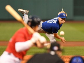 Toronto Blue Jays starting pitcher Ross Stripling pitches against the Boston Red Sox during the first inning at Fenway Park in Boston, June 11, 2021.