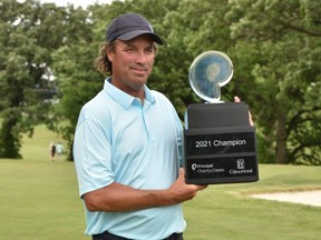 Stephen Ames holds the trophy after winning the Principal Charity Classic at Wakonda Club in Des Moines, Iowa, Sunday, June 6, 2021.