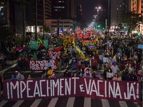 A controversial Brazilian virologist says he will be teaching at BCIT. The B.C. post-secondary institution says that's not the case. A file photo taken in May shows a demonstration in Sao Paulo, Brazil, against President Jair Bolsonaro's handling of COVID-19.