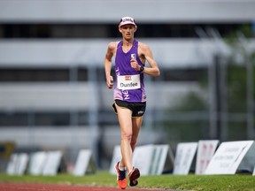 Evan Dunfee, of Richmond, races to a new Canadian record of 38:39.72 in the 10,000 metre race walk event during the Harry Jerome International Track Classic, in Burnaby, on Saturday