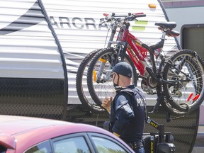 A police officer at the RV park where a full-patch Hells Angel was found dead in Surrey.