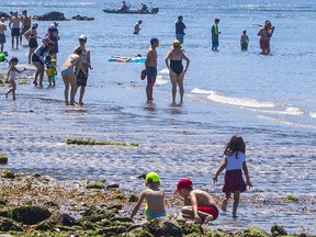 Kids playing during a heat wave at Ambleside beach, West Vancouver.