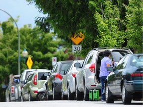 Parked cars on residential streets as the city proposal to charge a carbon fee to park a car, in Vancouver, BC., on June 14, 2021.