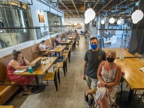 Kyle Logan and Sarah Harbord opened their Patina Brewing in Port Coquitlam early on Monday to accommodate patrons who usually work from home but were desperate for some air conditioning.