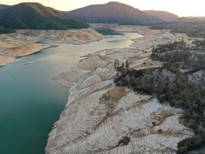 An aerial view shows low water levels at Lake Oroville, which is the second largest reservoir in California and according to daily reports of the state's Department of Water Resources is near 35 per cent capacity, near Oroville, California.