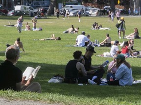 People enjoy the sunny weather in Jeanne-Mance Park on May 17, 2021.