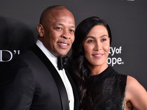 Dr. Dre (L) and Nicole Young attend the City of Hope Spirit of Life Gala 2018 at Barker Hangar on October 11, 2018 in Santa Monica, California.