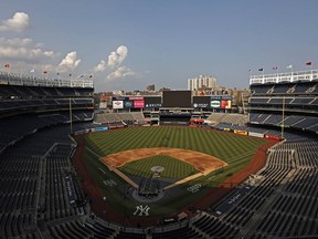 Members of the Boston Red Sox take batting practice at Yankee Stadium on July 15, 2021, before the game was postponed due to positive COVID-19 tests among Yankee players.