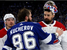 Carey Price of the Montreal Canadiens and Nikita Kucherov of the Tampa Bay Lightning shake hands following the Lightning's 1-0 victory in Game Five to win the 2021 NHL Stanley Cup Final at Amalie Arena on July 07, 2021 in Tampa, Florida.